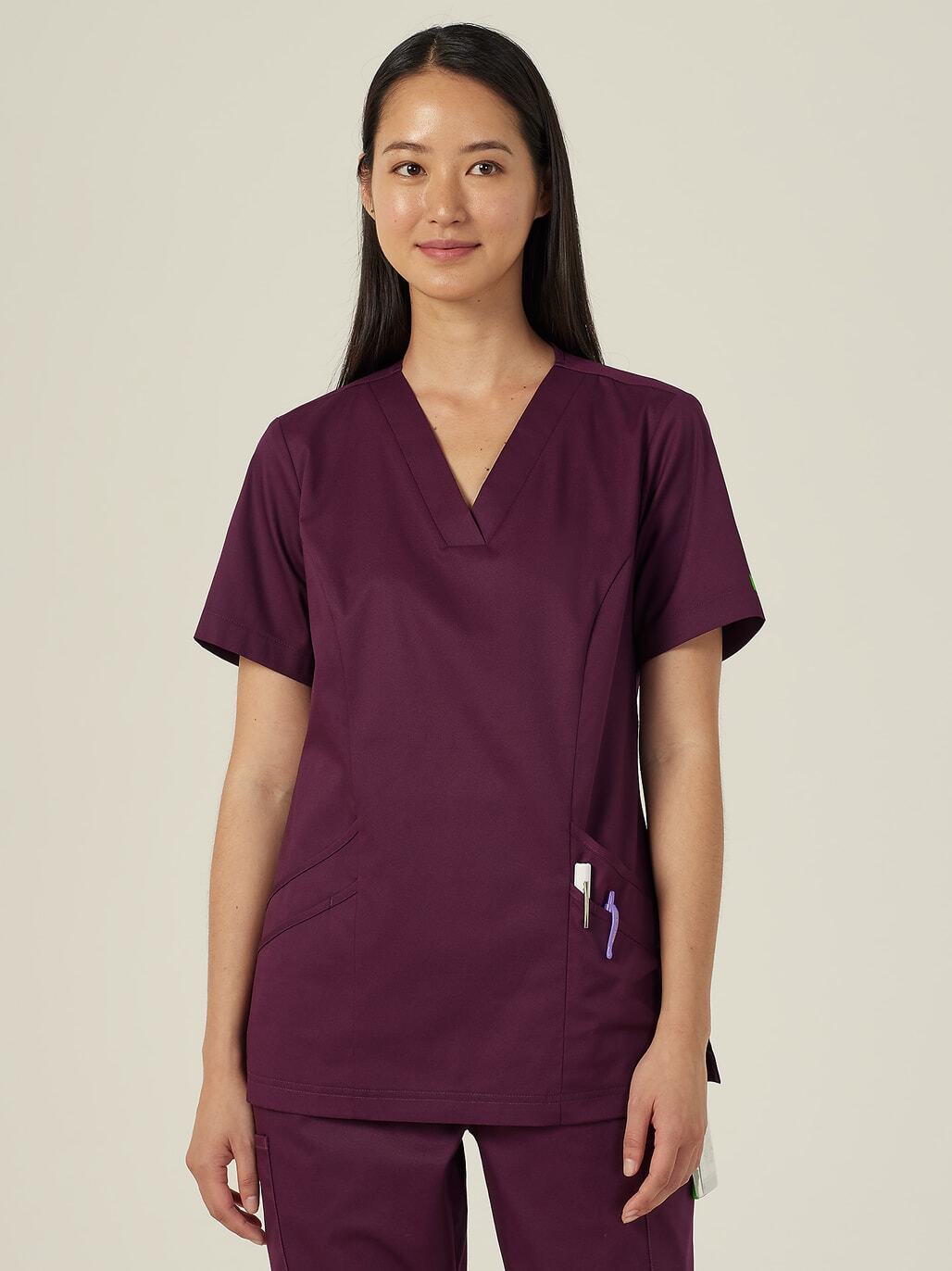 A woman in purple scrubs.