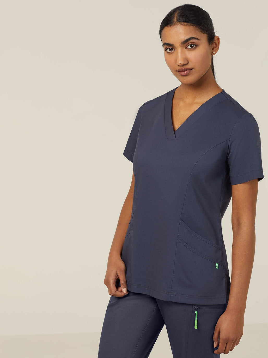 Woman in navy blue scrubs.