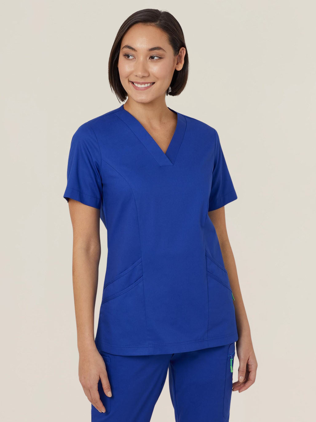 Woman wearing blue scrubs.