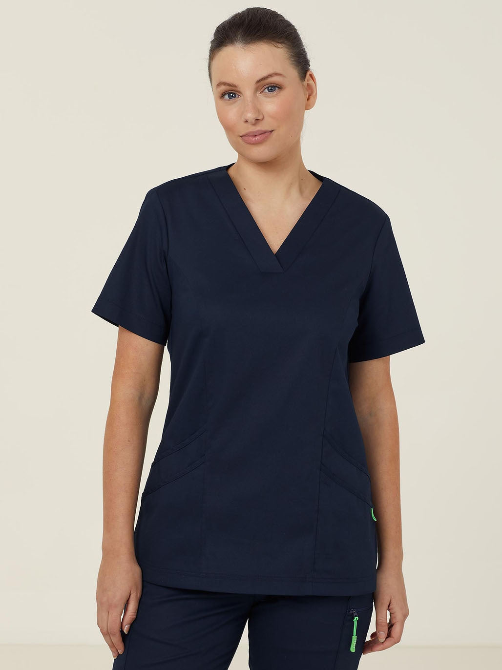 Woman in navy blue scrubs.