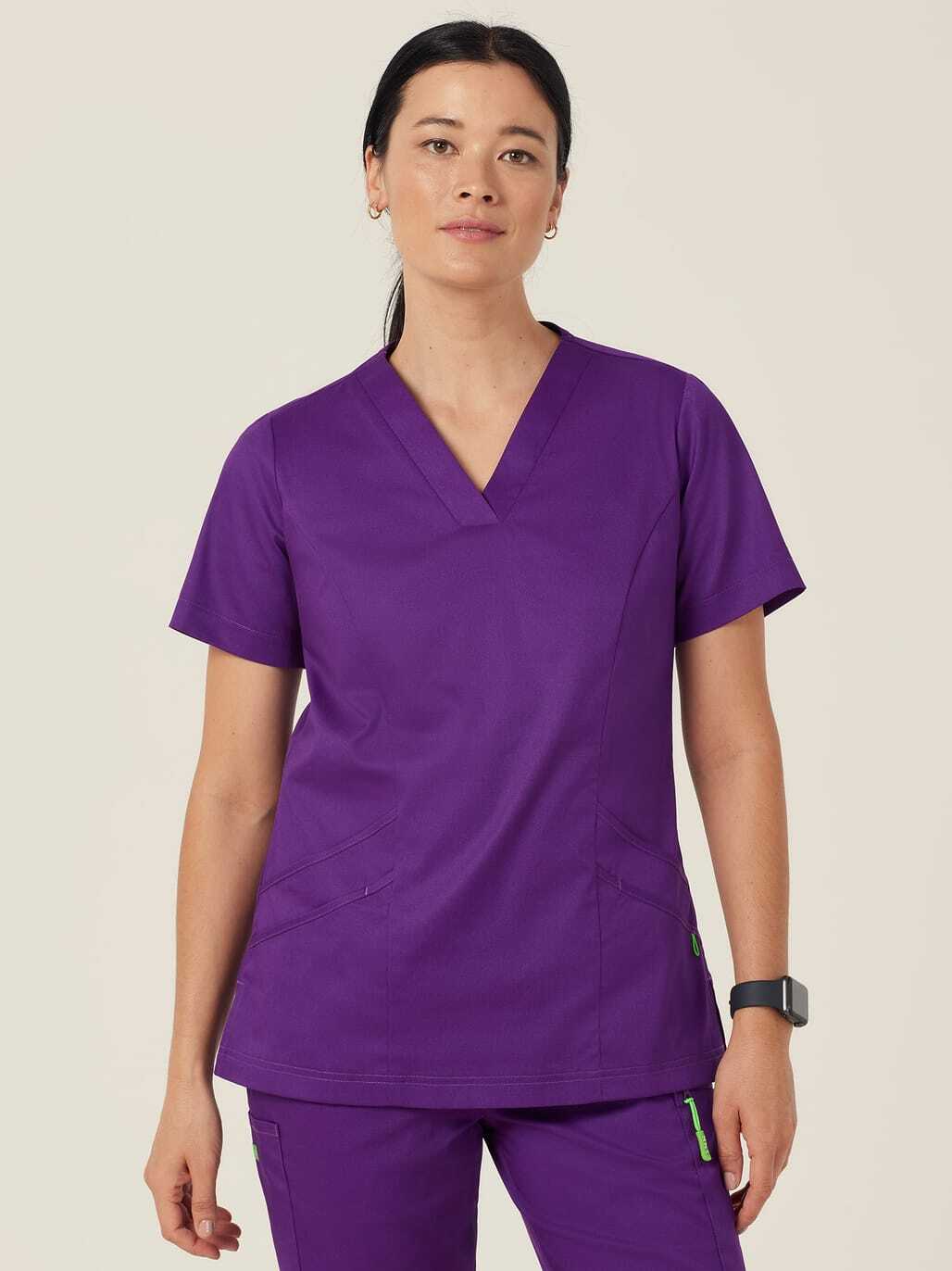 A woman in purple scrubs.
